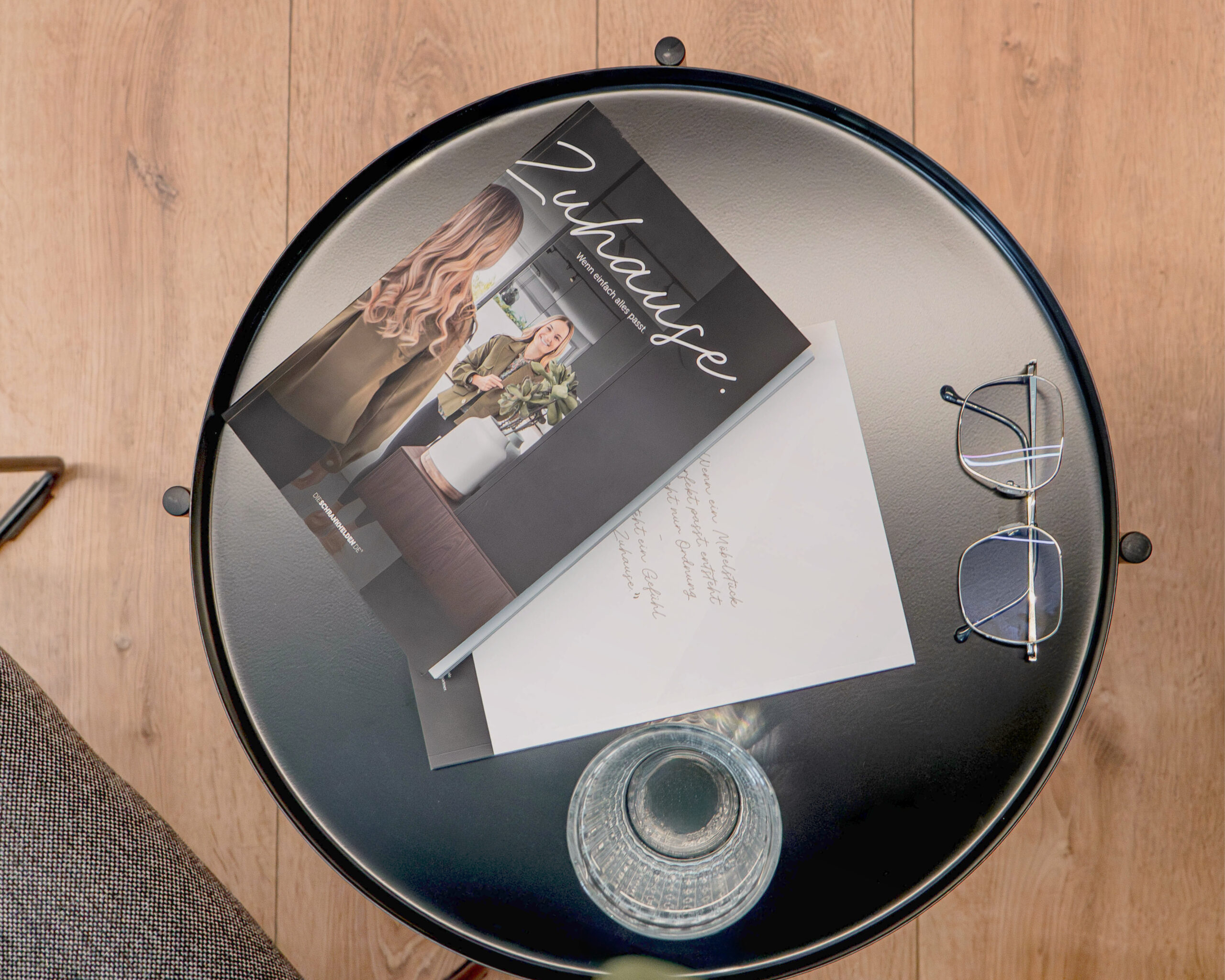 "Zuhause" magazine from Cabinetheroes on a round side table