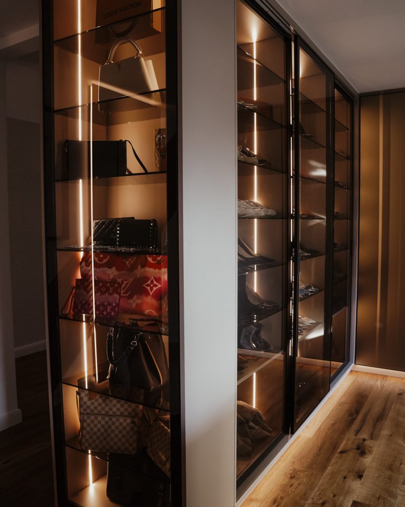 Walk-in closet with glass doors and aluminum frames