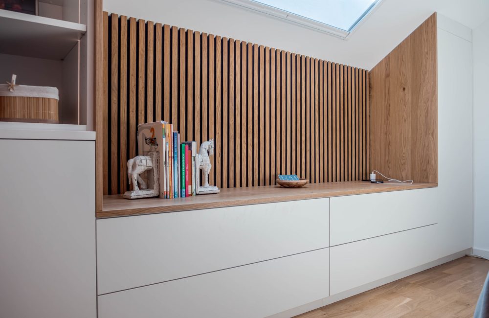 White paneled knee wall cabinet