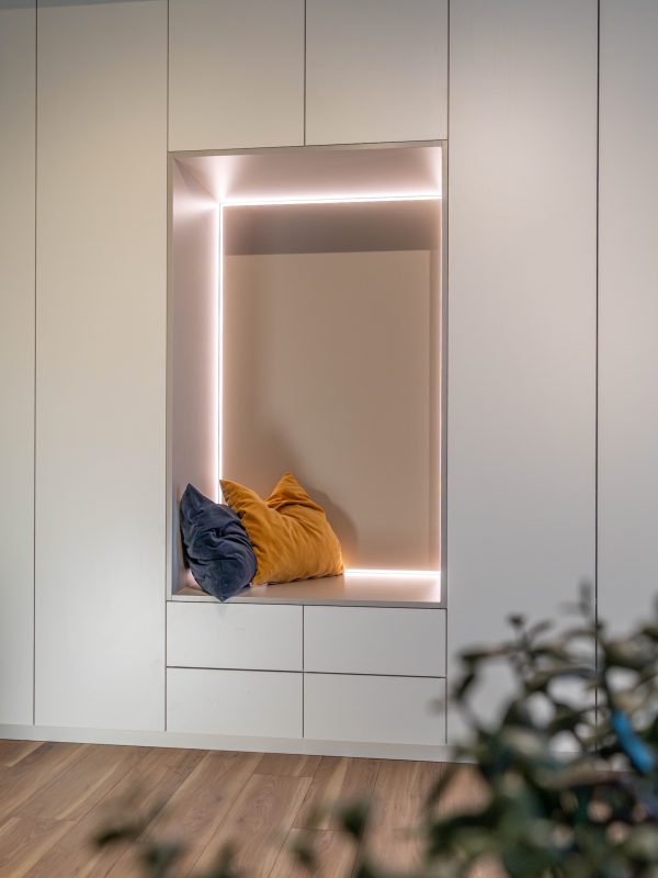 Sloped-Ceiling Cabinet, Matte White with Light Gray Inlay and Seating Niche with LED Lighting