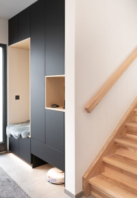 Black wardrobes with wooden elements and bench