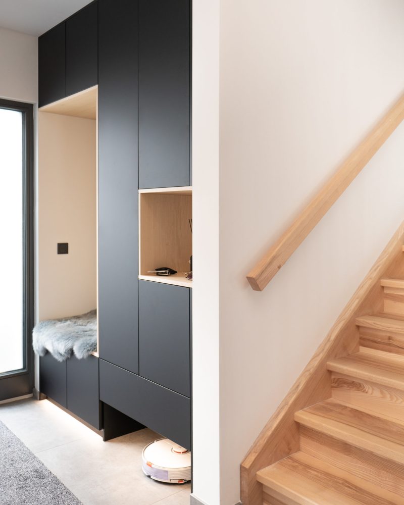 Black wardrobes with wooden elements and bench