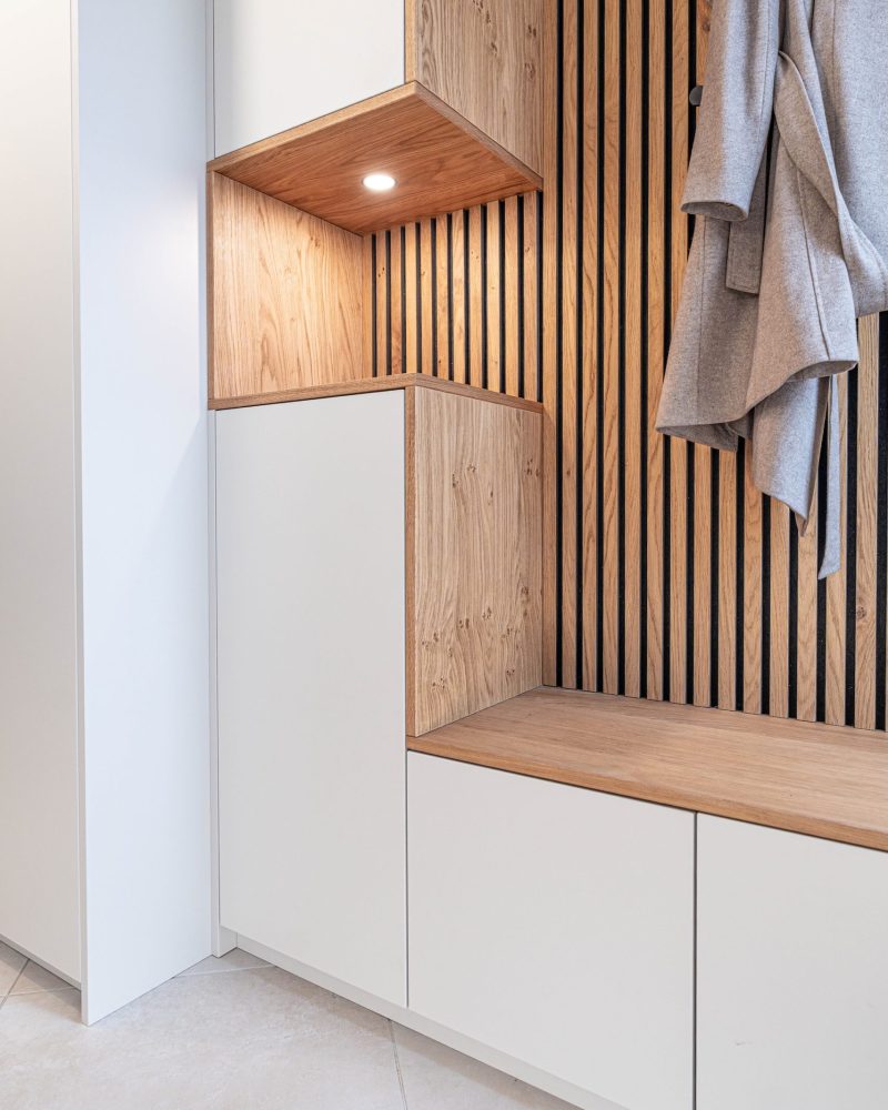 Wardrobe in matt white oak panels Shelf LED spotlight