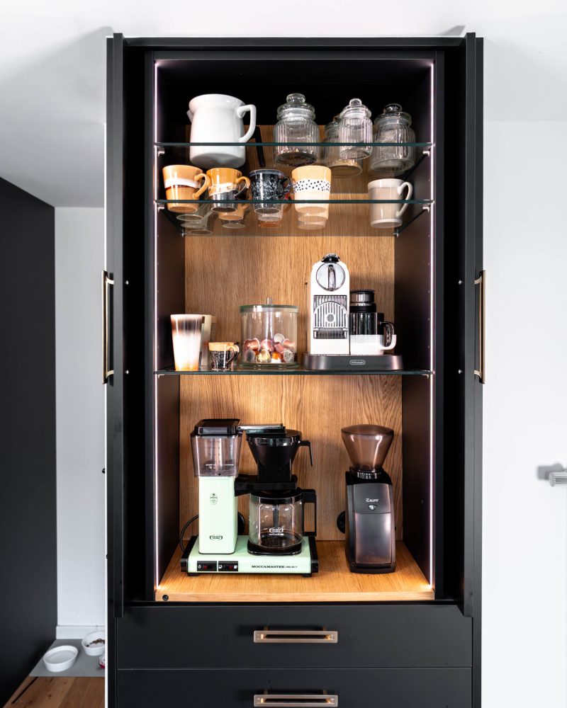 Coffee cabinet matt black with retractable doors and LED