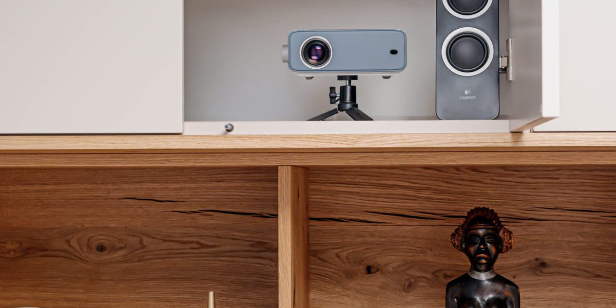 Champagne-colored wild oak bed conversion with a hidden projector