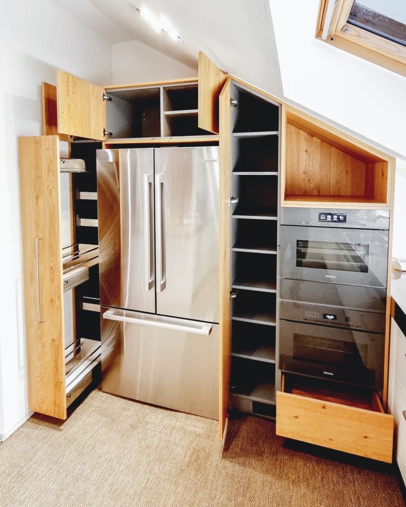 Kitchen under sloping roof in wild oak