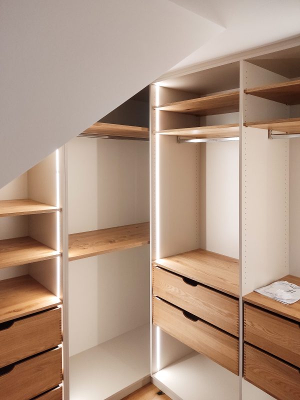 Walk-in closet in a sloped alcove