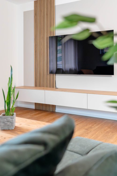 Floating sideboard in light beige with wall panels