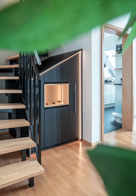 Staircase cupboard closed fronts black matt antifingerprint inlay fir