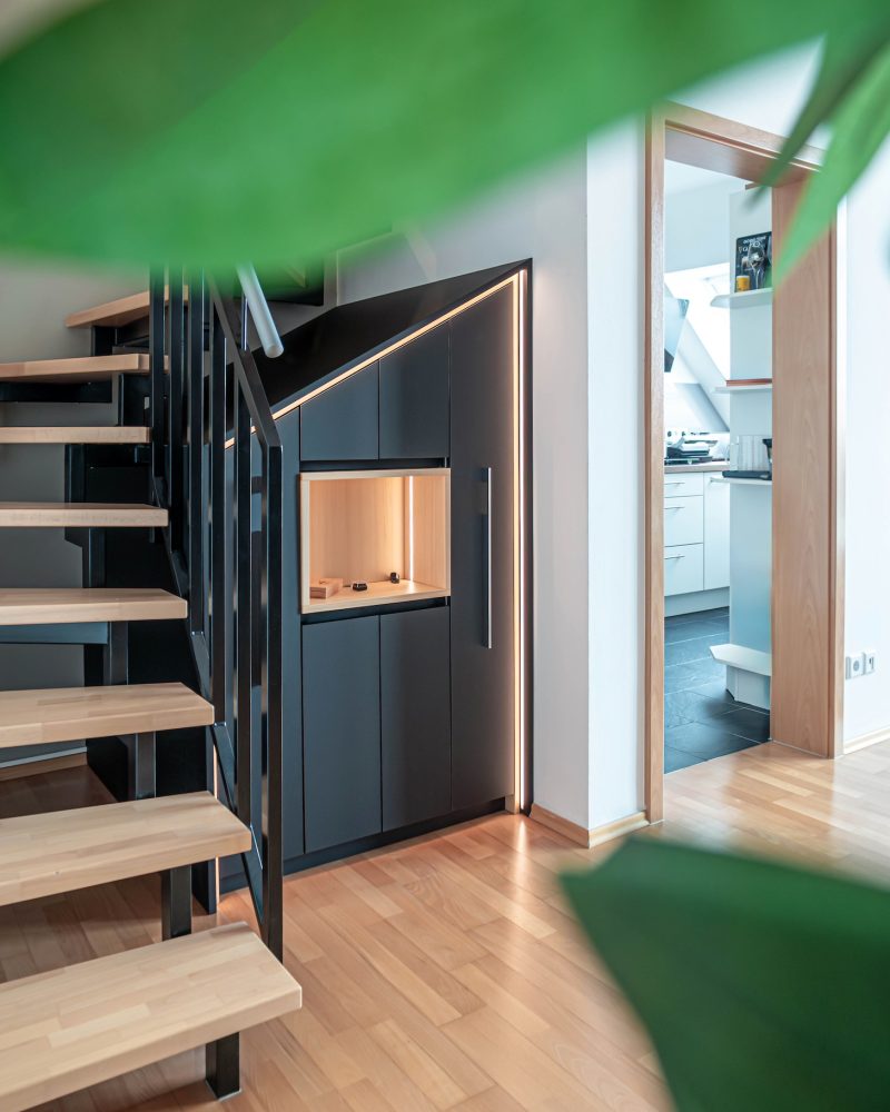 Staircase cupboard closed fronts black matt antifingerprint inlay fir