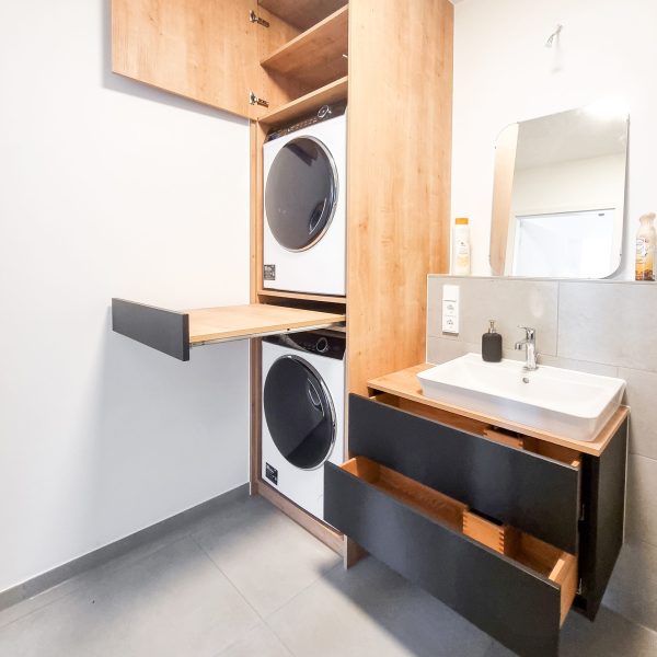 Wooden washing machine cabinet with black fronts