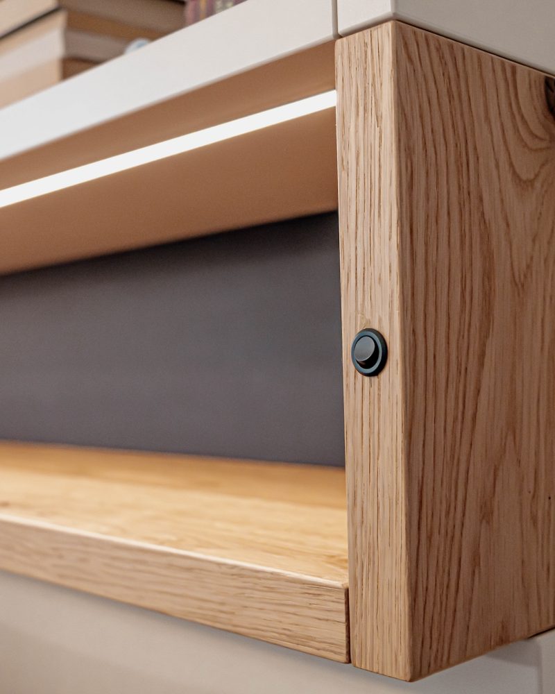 Living Room Wall Unit Close-up: Light Switch, Champagne Inlay Trim, Wild Oak LED Strips