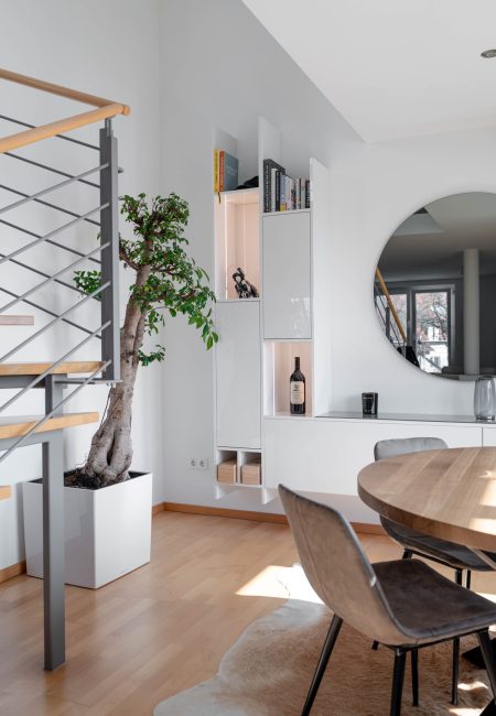 High-gloss white wall unit in an open-concept living room