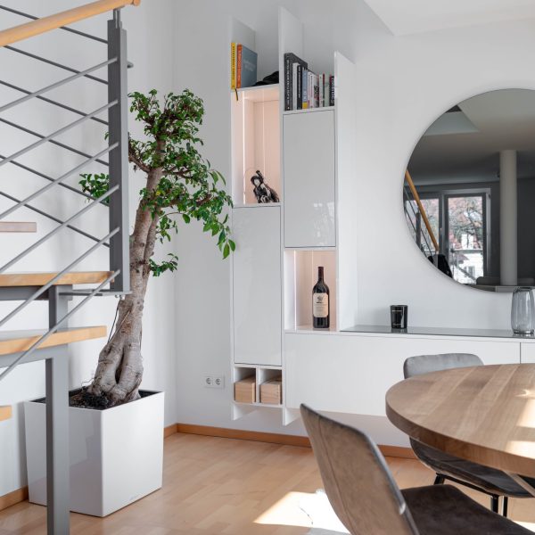 High-gloss white wall unit in an open-concept living room