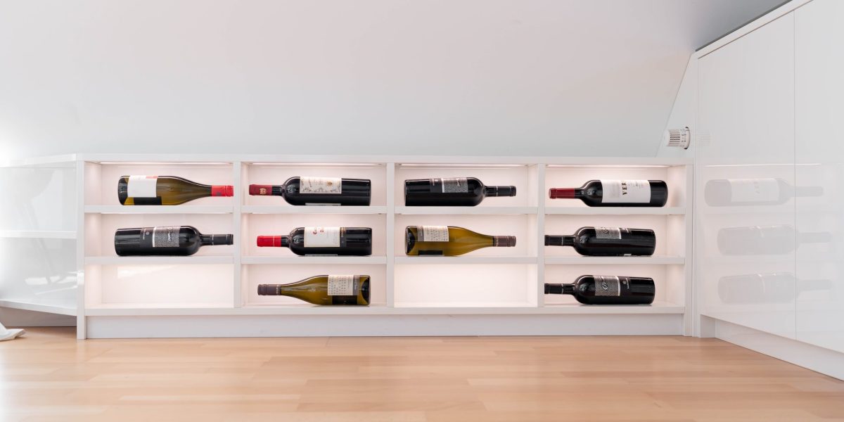Built-in wine rack in a white high-gloss sideboard