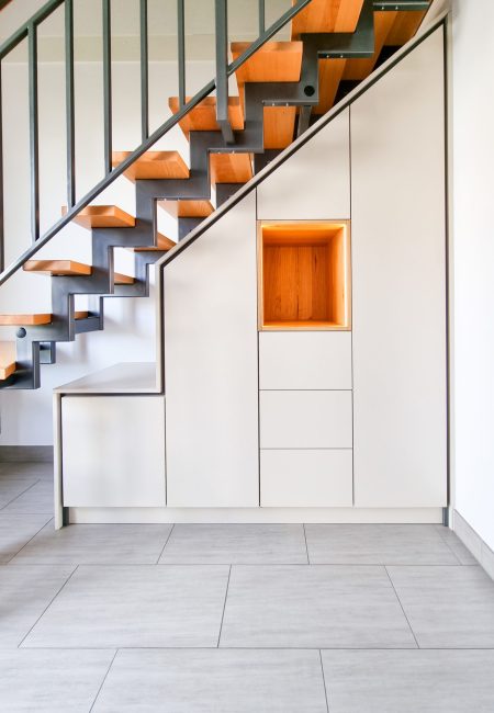 White staircase cabinet with oak inlay and LED lighting